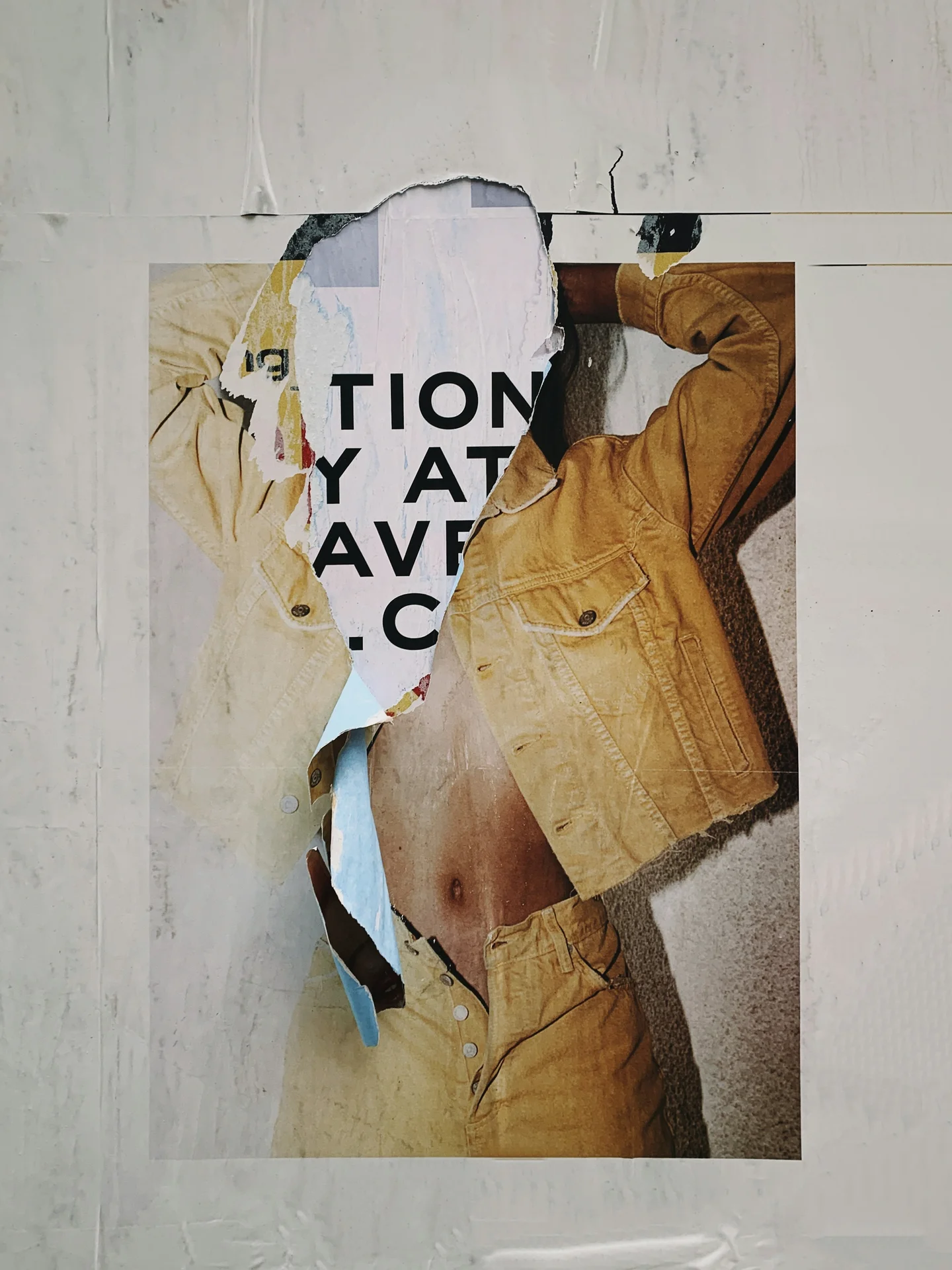 Torn fashion poster with a mustard denim jacket, layered street imagery
